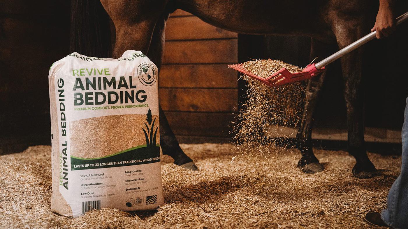 REVIVE animal bedding bag in a horse barn