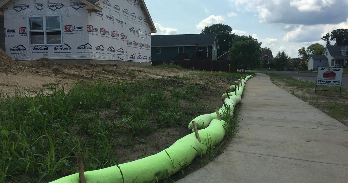 AGgrow Wattle installed along a sidewalk at a home construction site