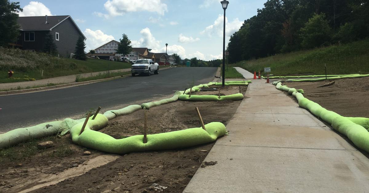 AGgrow Wattle filter sock lining a roadside sidewalk